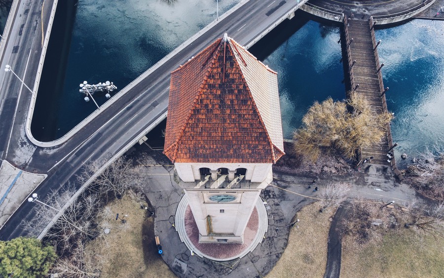 Aerial Antiquities: Timeless Tower Over Tranquil Waters
