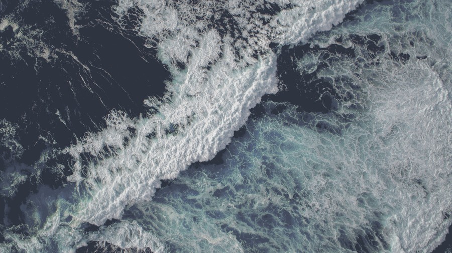 Aerial Rhythms: The Ocean's Dynamic Whisped Dance