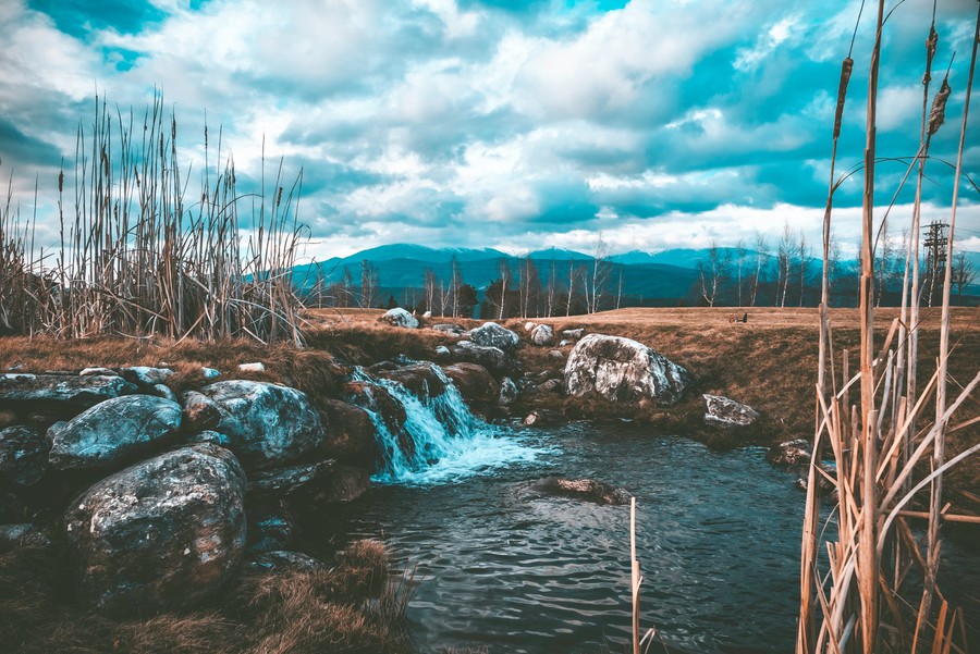 Serene Autumn Landscape with Mountain Falls