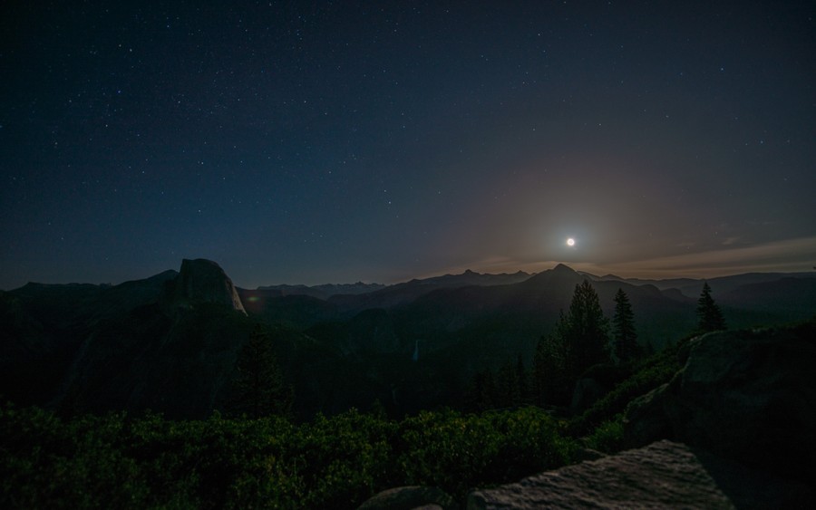 Celestial Starry Silhouette: Night Over Moonlit Peaks