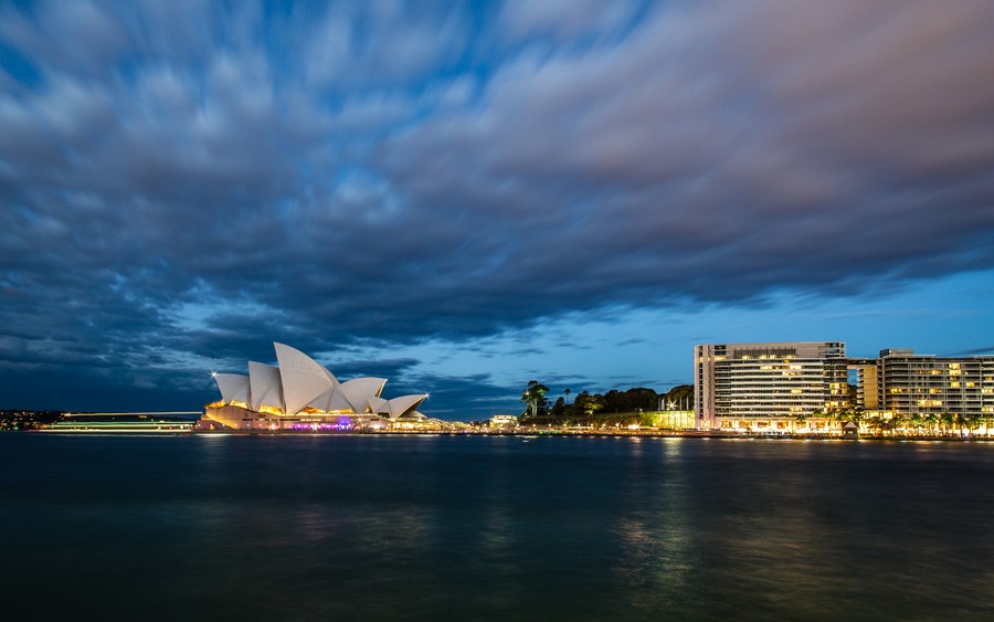 Illuminated Elegance: Sydney Opera House at Nighttime Over Harbor Serenity