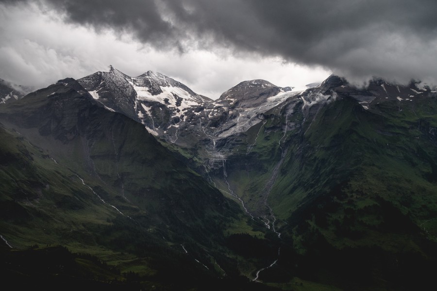 Majestic Alpine Peaks Under a Stormy Sky: Nature's Grandeur