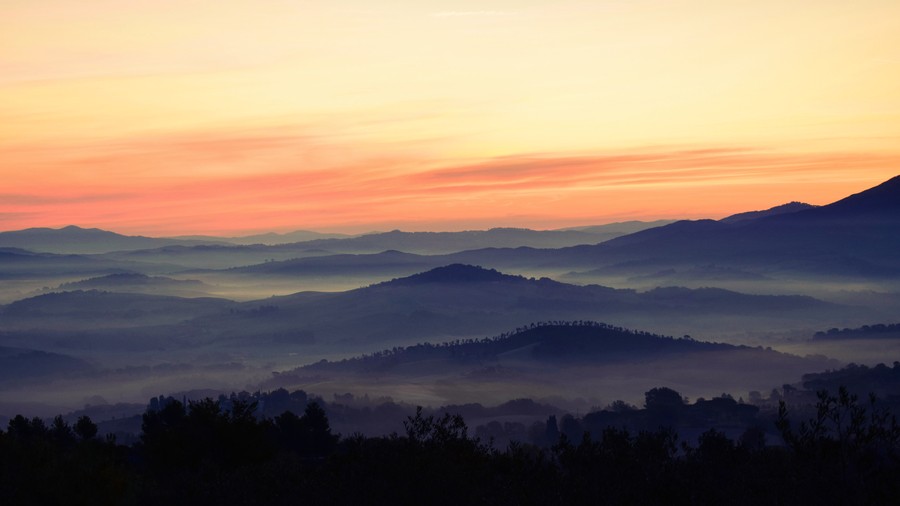 Celestial Harmony: Misty Mountain Peaks at Golden Hour