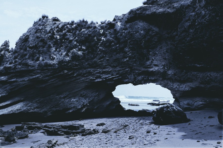 Monochrome Haven: Where Cliffs Embrace the Ocean