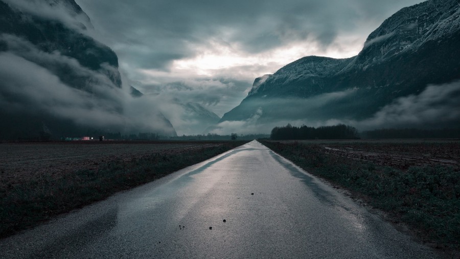 Veil of Twilight: A Moody Foggy Mountain Road