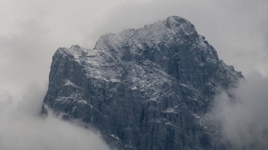 Mysterious Gray Peak: A Majestic Rock Formation Veiled in Mist