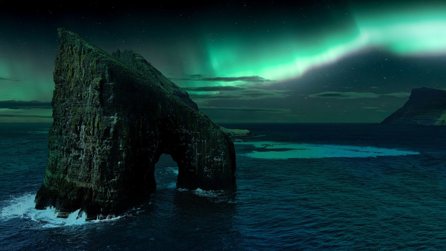 Northern Lights Over Coastal Cliffs