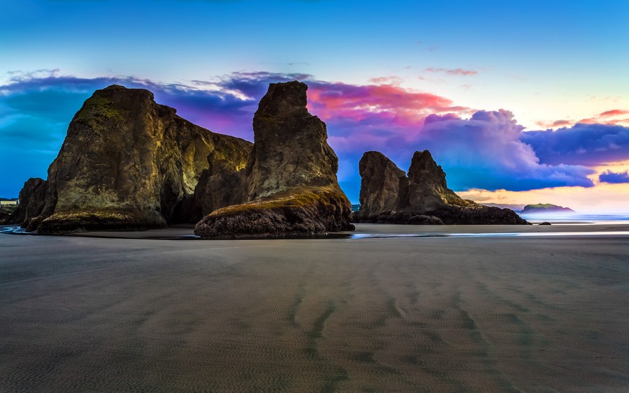 Serene Sunset Beach: Where Rocks Whisper to the Sky