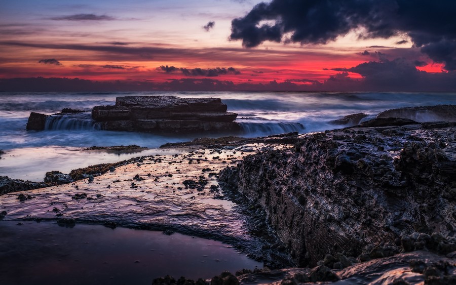 Twilight Serenity: Coastal Waves Under a Dramatic Dusk Sky