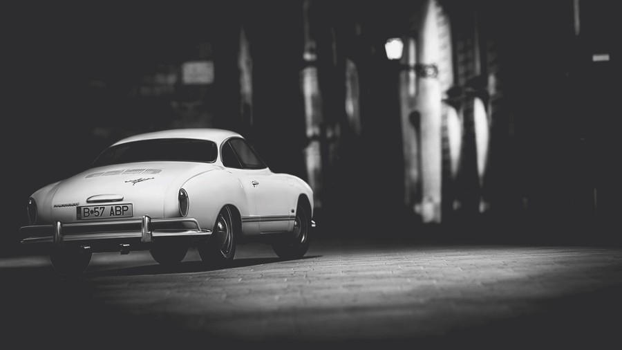 Midnight Motion: Vintage Car on Brick Streets