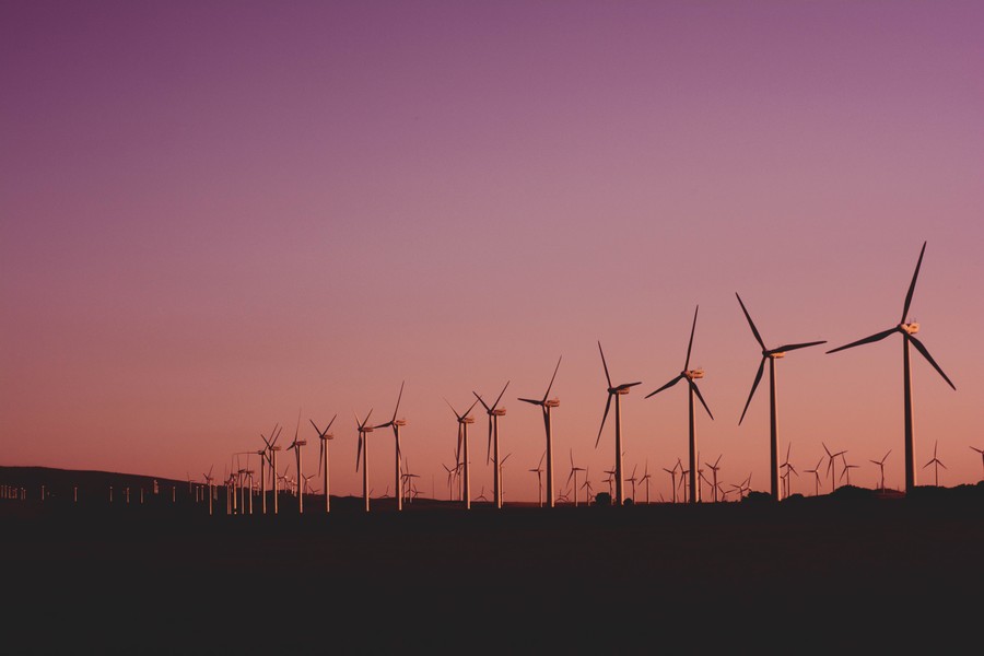 Silhouetted Wind Turbines at Dusk: A Gradient of Energy and Sky