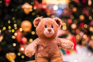 Cozy Christmas Teddy Bear in Festive Wonderland - Cute Wallpaper