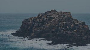 Obsidian Tempest: Jagged Cliffs Roared by Rogue Waves - Cute Wallpaper