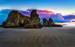 Serene Sunset Beach: Where Rocks Whisper to the Sky - Cute Wallpaper