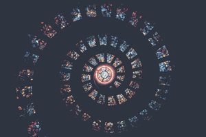 Spiral of Light: Vibrant Stained Glass Mandala in Cosmic Harmony - Cute Wallpaper