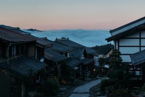 Traditional Village at Dusk: Serene Cloud-Kissed Countryside - Cute Wallpaper