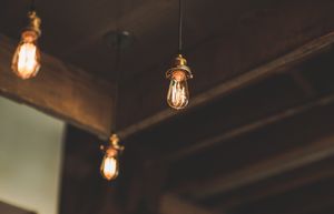 Warm Industrial Ambience with Hanging Edison Bulbs - Cute Wallpaper